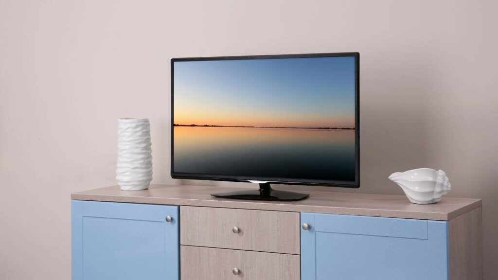 Tranquil Ambiance: Stylish 32 Inch LED Full HD TV Console with Serene Desktop Wallpaper and Accessory Space