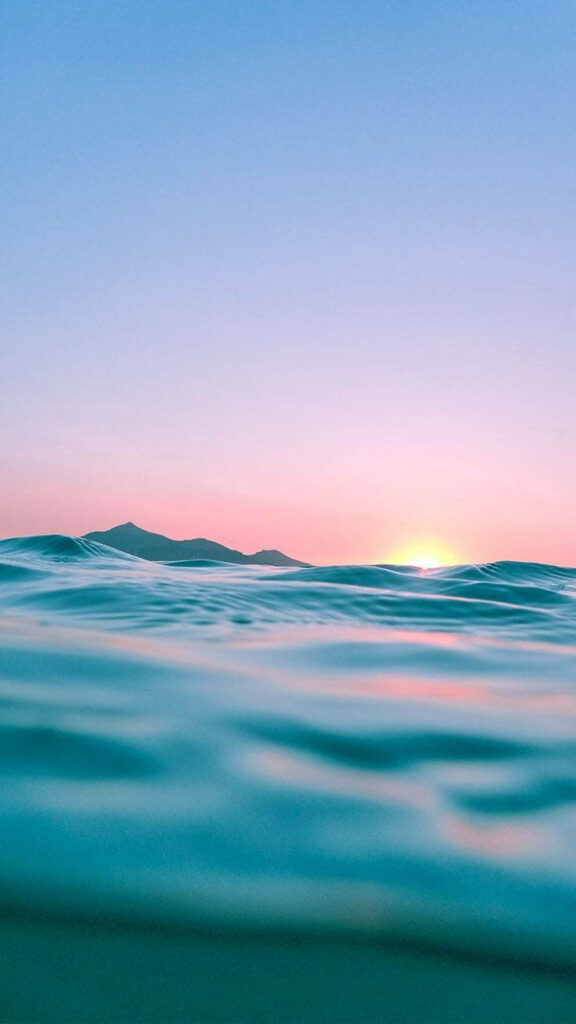 Serene Sunset on the Horizon: A Minimalist iPhone Wallpaper