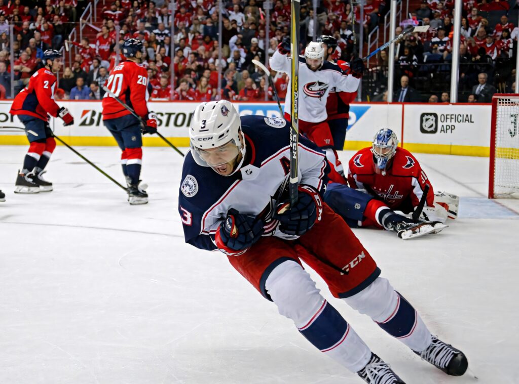 Seth Jones intense hockey action on ice with vibrant team colors and dynamic game movement Wallpaper
