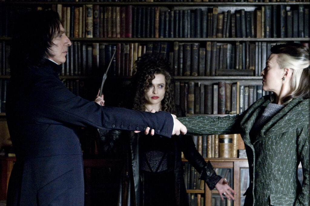 Severus Snape Bellatrix Lestrange Narcissa Malfoy tense moment Hogwarts Library magical bookshelf Wallpaper