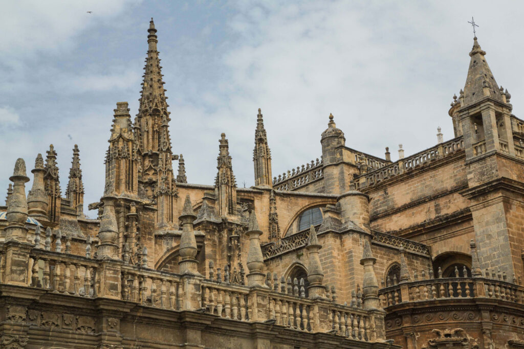 Intricate Seville Cathedral Wallpaper: Gothic Spires & Carvings