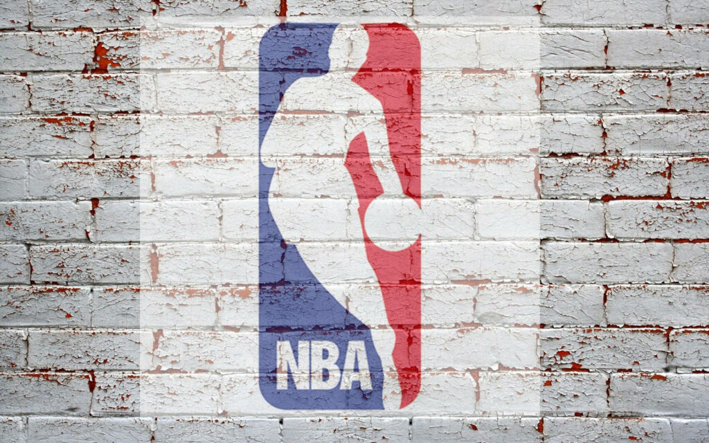NBA Logo Fan Art on Textured Brick Wall with Basketball Player Silhouette Wallpaper