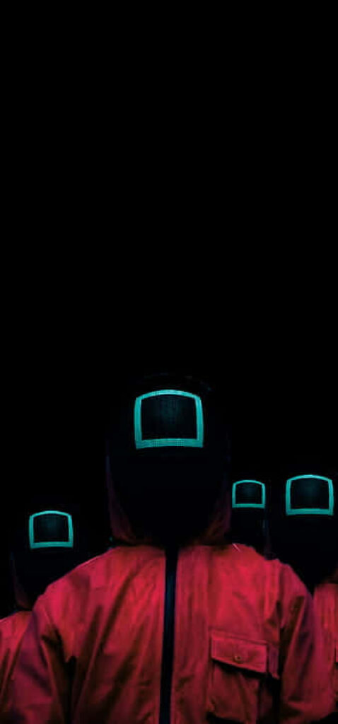 Shadowed Sentinels: Mysterious Squid Game Guards Concealed Amidst Darkness Wallpaper