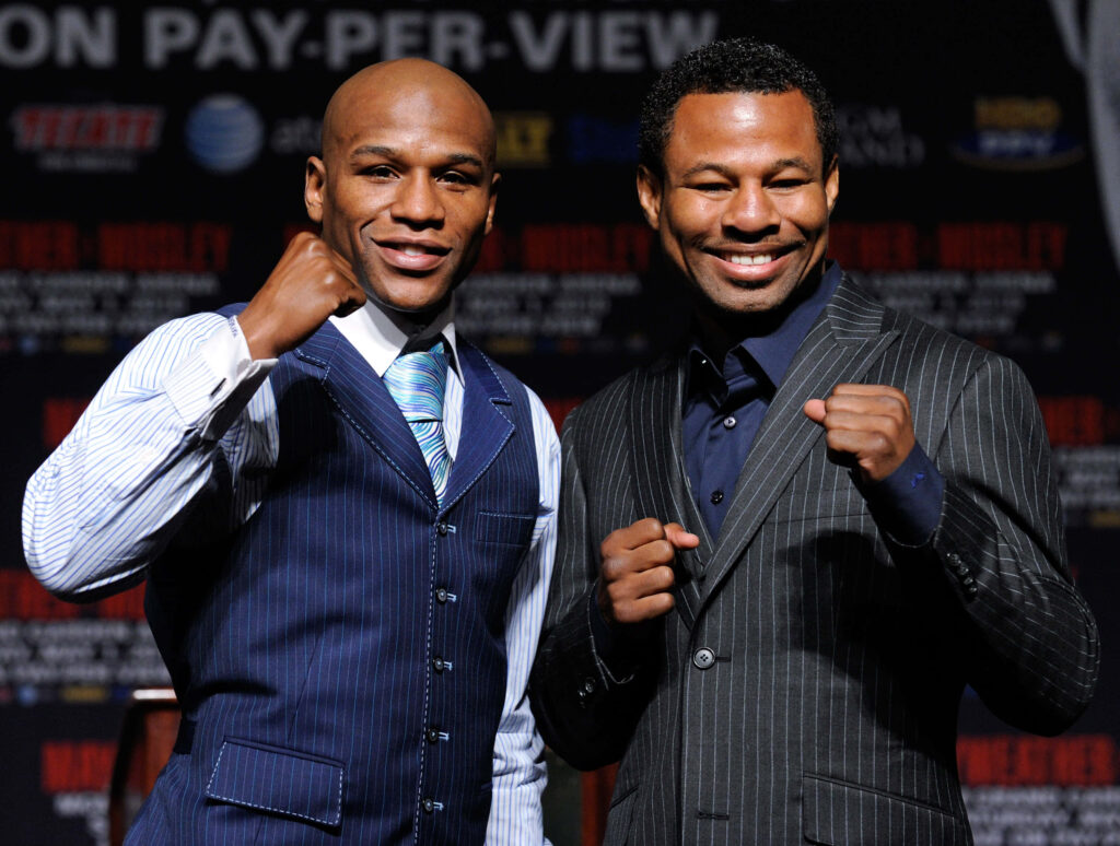 Shane Mosley & Floyd Mayweather: Confident Duo in Stylish Wallpaper