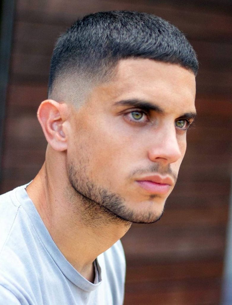 Sharp men's hairstyle wallpaper featuring Edgar haircut with textured crop and skin fade