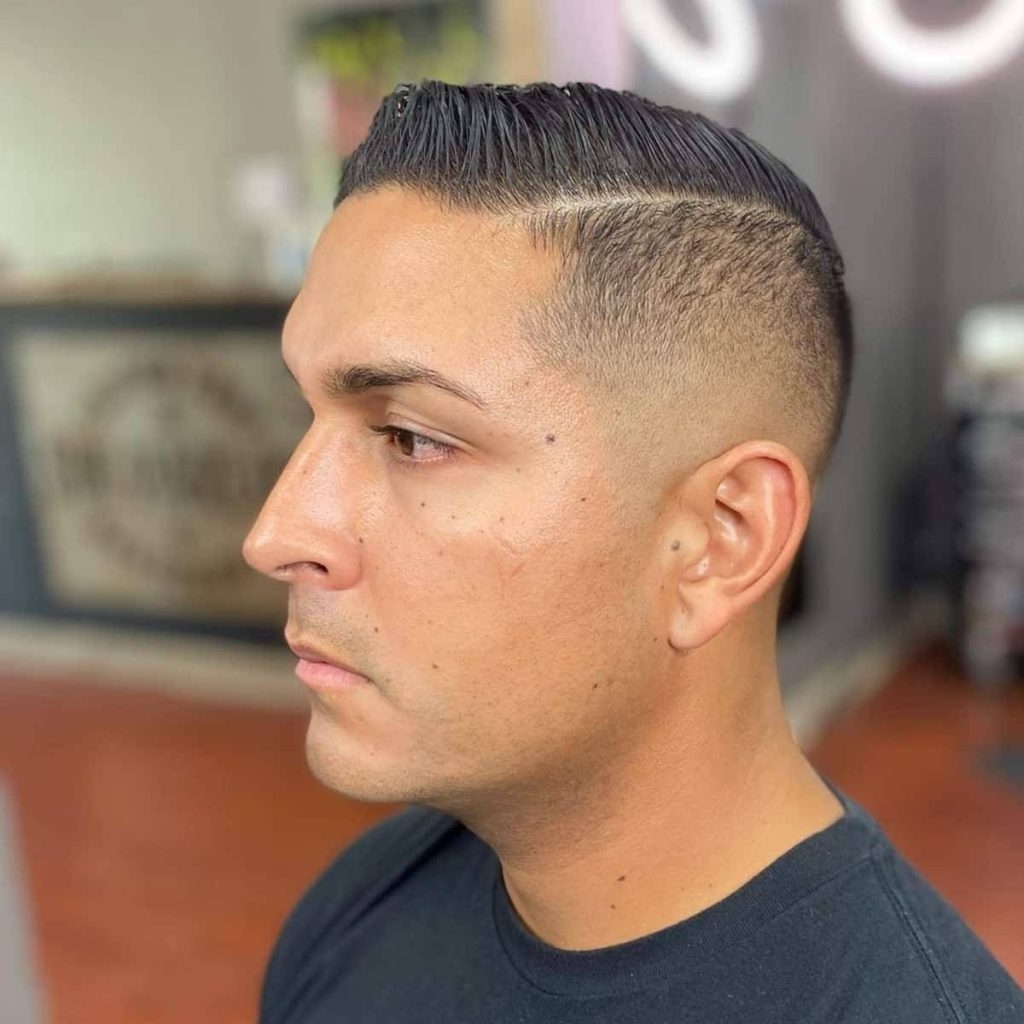 Man's sharp regulation cut with high skin fade and defined hard part modern grooming wallpaper