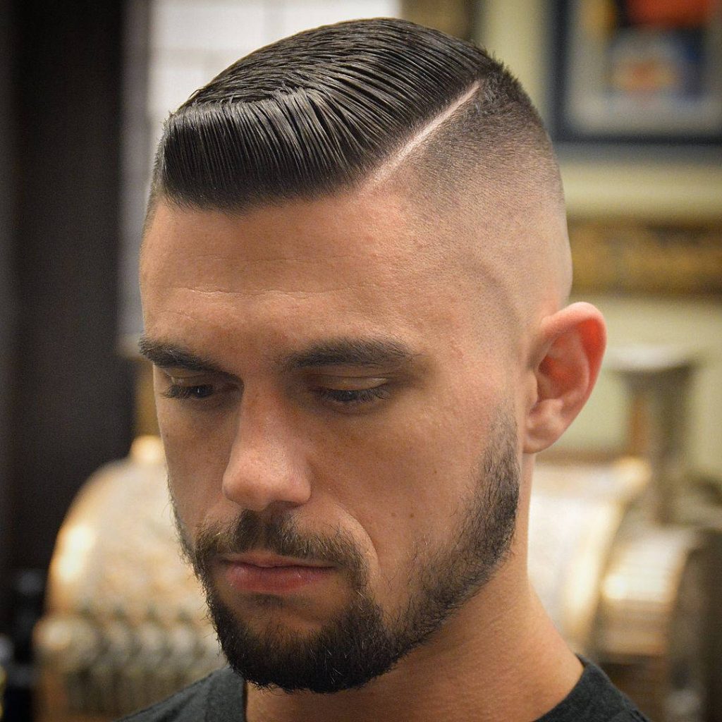 Sharp men's hairstyle wallpaper featuring a side-parted fade and neatly groomed beard for style