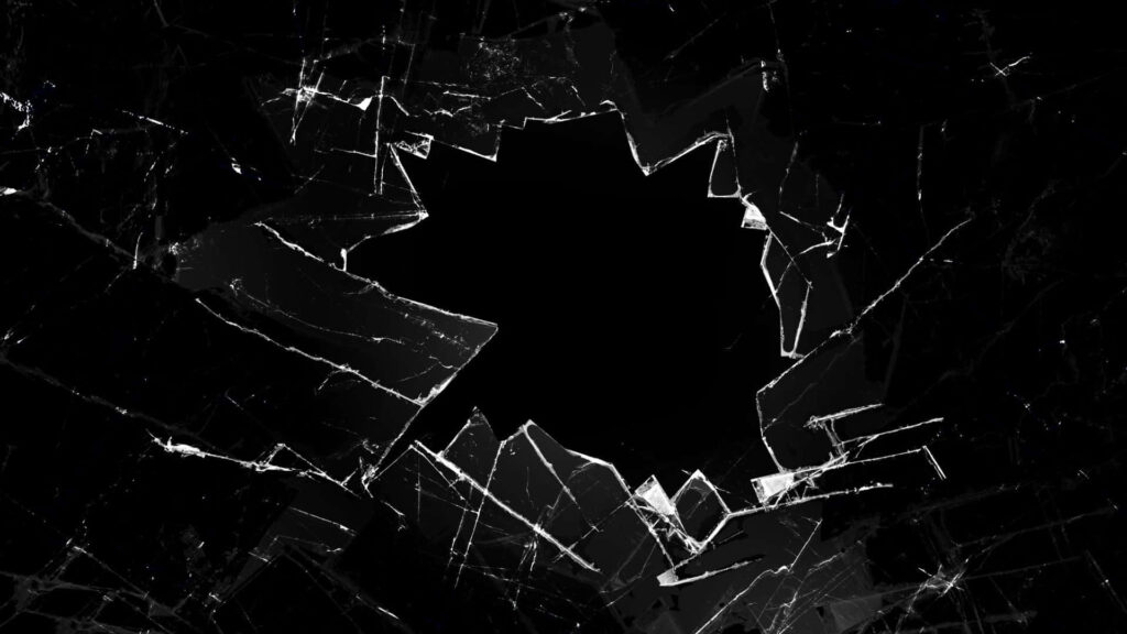 Shattered glass abstract wallpaper with jagged shards radiating from black center monochrome design