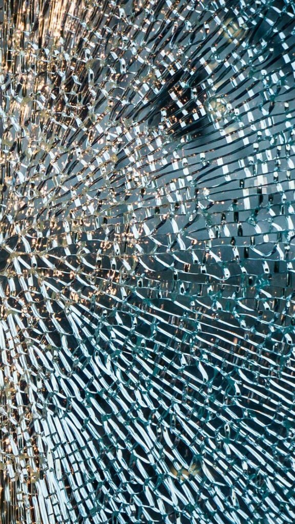 Shattered glass wallpaper with reflective blue silver shards abstract broken screen theme for OnePlus 9R