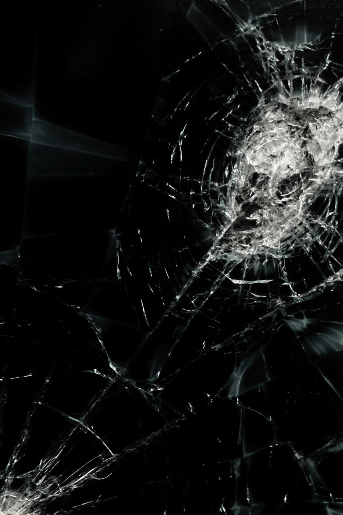 Fragmented Glass: An Intricate Pattern of Shattered Screen Damage Wallpaper
