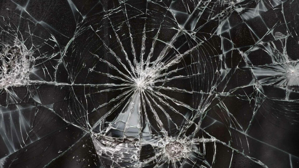 Shattered Glass Fusion: A Cracked Computer Screen Wallpaper with a Windshield Twist