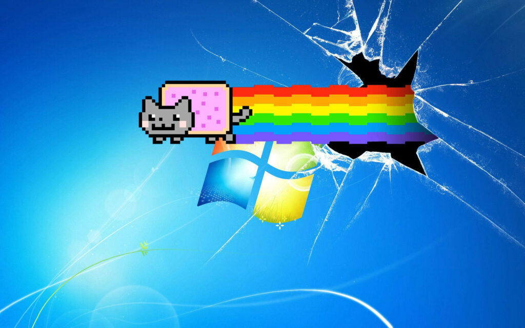 Pixelated Dreams: The Nyan Cat Rainbow Trail through a Shattered Windows 7 Screen Wallpaper