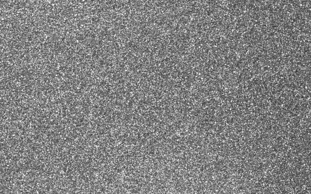 Shimmering Silver Elegance: A High-Definition Glitter Texture Wallpaper on Gray Background