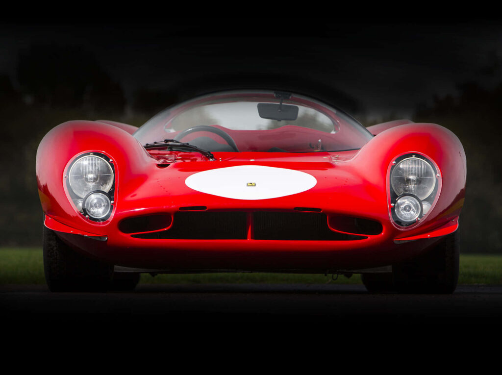 Iconic Beauty: A Summer Sonata of Radiant Yellow: A Captivating Classic Ferrari in All Its Glory Wallpaper
