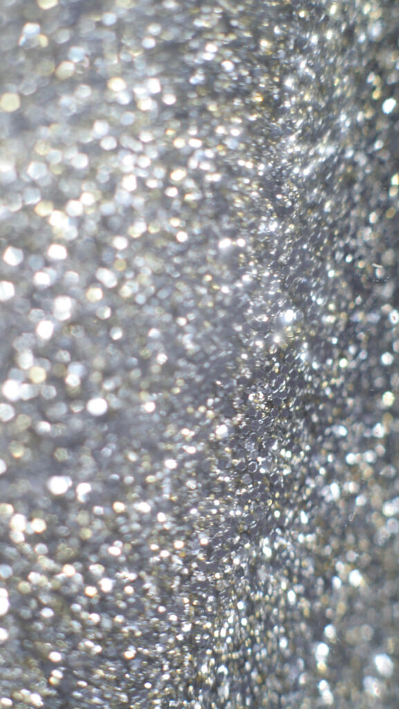 Shimmering Silver Stardust: A Captivating Macro Abstract Background Wallpaper