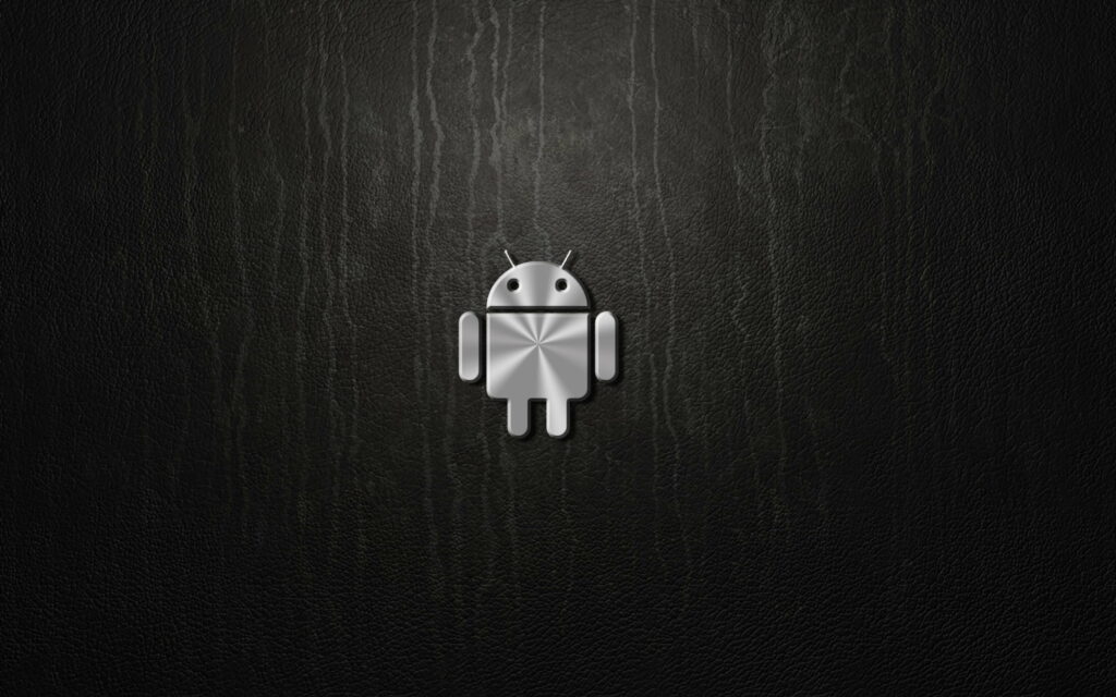 Sleek 4K Android robot logo in brushed metal on black leather textured minimalist wallpaper