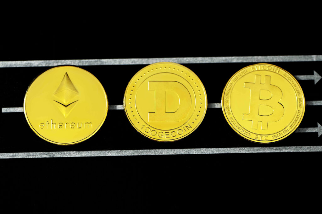 Shiny gold Dogecoin Ethereum Bitcoin on sleek black background vibrant crypto currency wallpaper