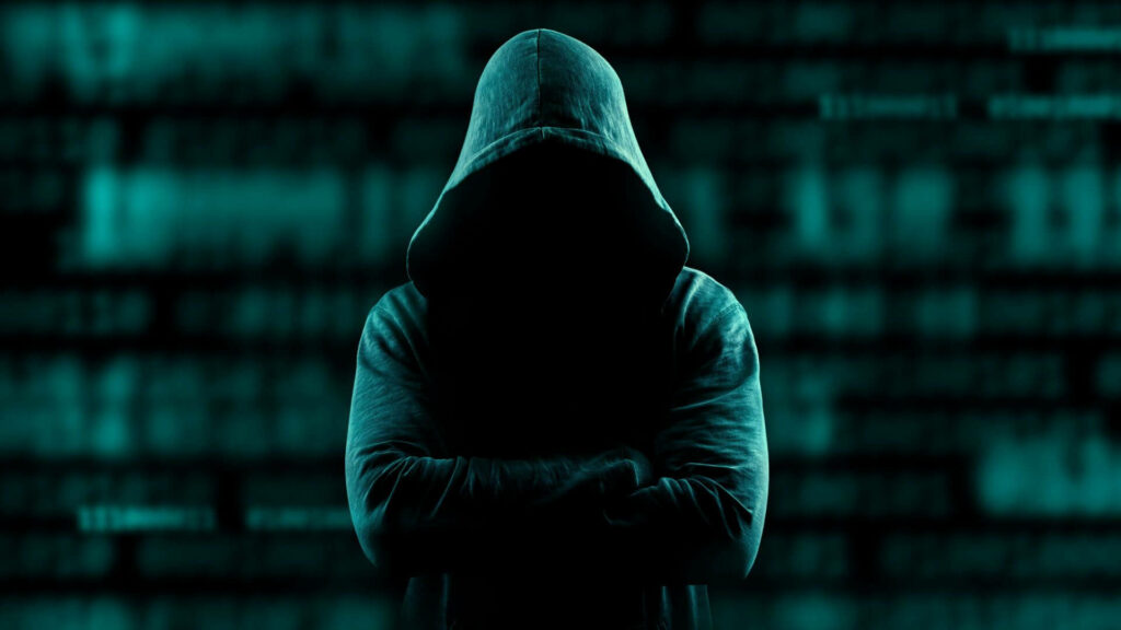 The Enigmatic Cyber Criminal: Illuminated in Blue, a Full HD Hacker Background Wallpaper