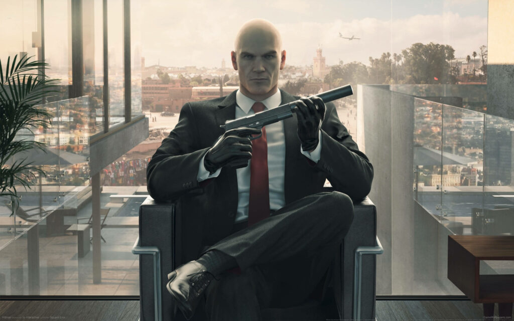 The Calm Before the Storm: Agent 47 Prepares for Deadly Precision Wallpaper