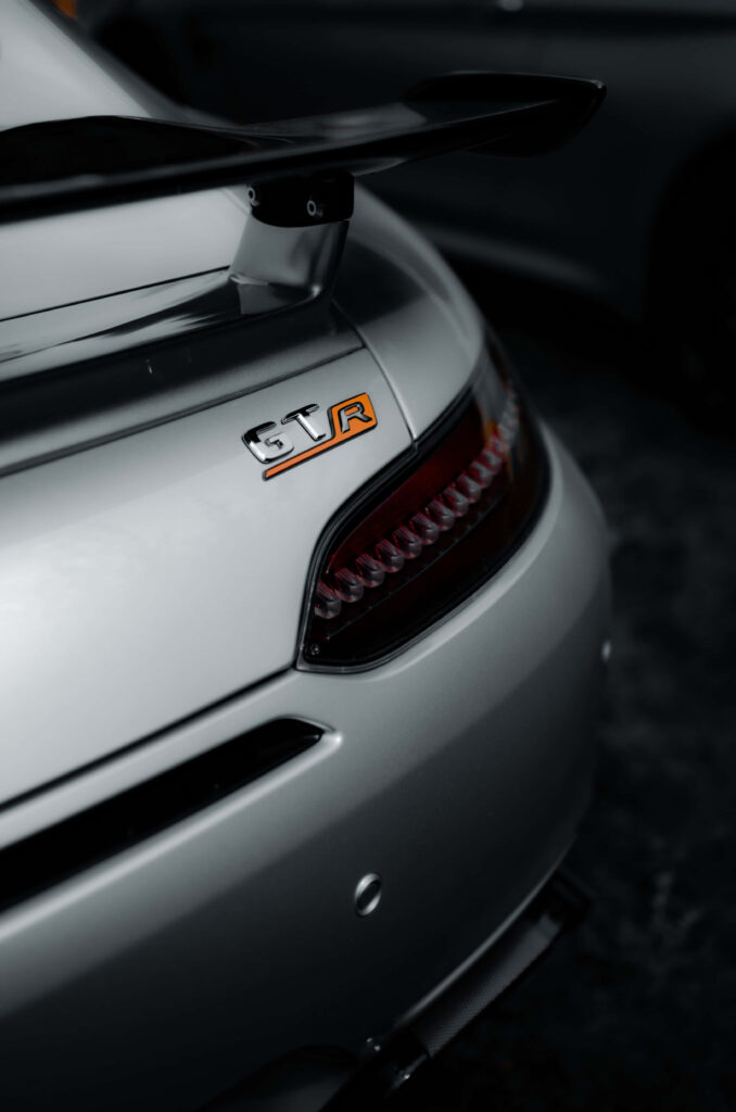 Close-up of silver AMG GT-R rear with bold GT-R badge and aerodynamic spoiler wallpaper