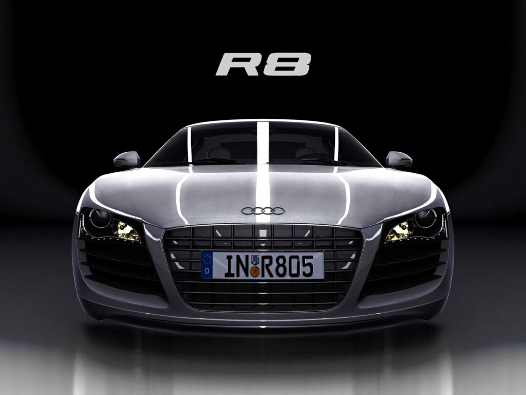 Front view of silver Audi R8 with iconic grille sleek headlights premium design wallpaper