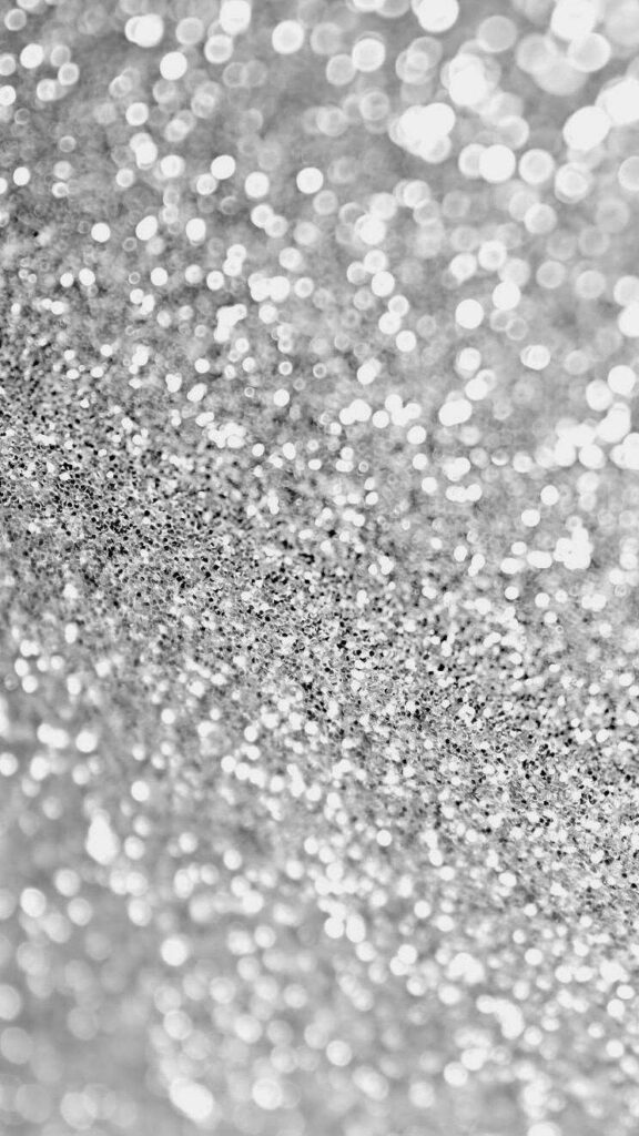 Shimmering Silver and Black Glitter Close-Up: Perfect iPhone Background Wallpaper