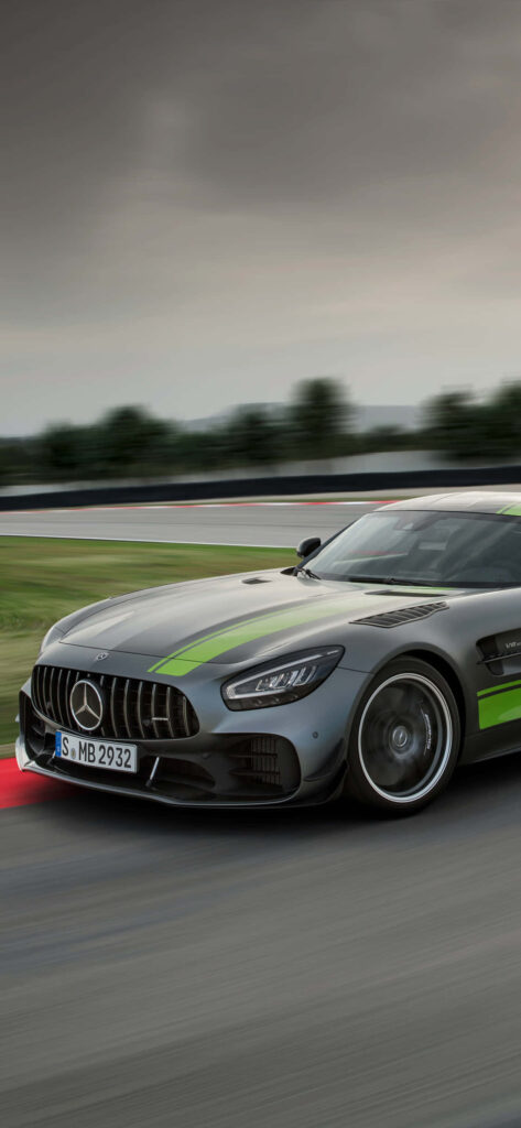 Silver and green Mercedes AMG racing on track showcasing high performance and bold design wallpaper