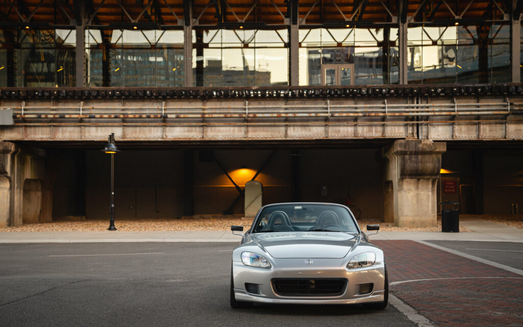 Dynamic Front View of Silver Honda S2000 in Urban Wallpaper