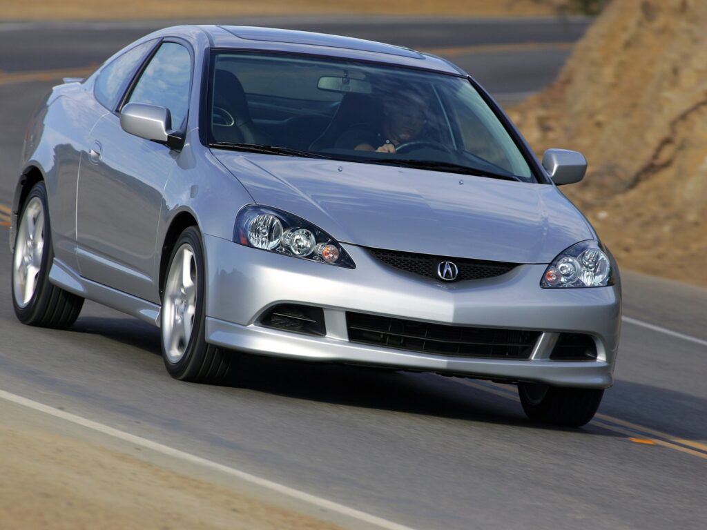 Stylish Silver Acura RSX Front View Wallpaper on Winding Road