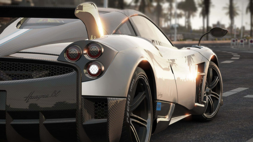 4k wallpaper silver Pagani rear view carbon fiber details sunlit city street background
