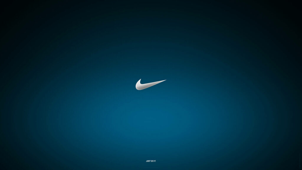 Shimmering Silver Nike Emblem against a Vibrant Blue High-Definition Backdrop Wallpaper