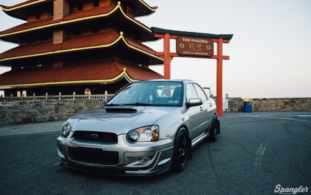 Silver Subaru Side View with Pagoda Background - Unique Contrast Wallpaper