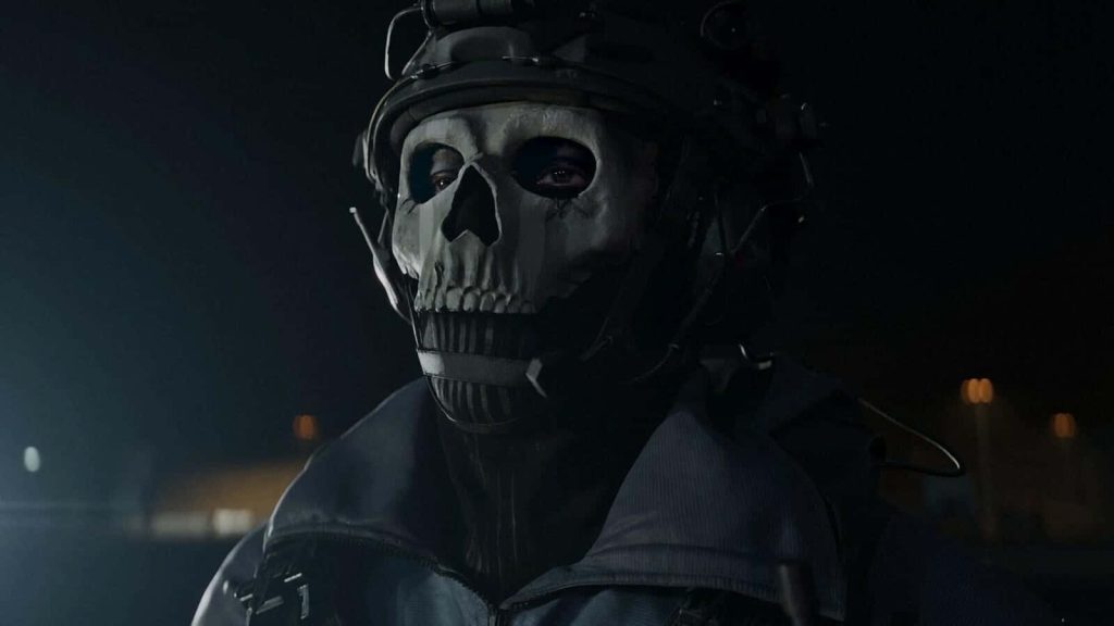 Close-up of Simon Ghost Riley with skull mask and tactical gear in dark dramatic lighting wallpaper