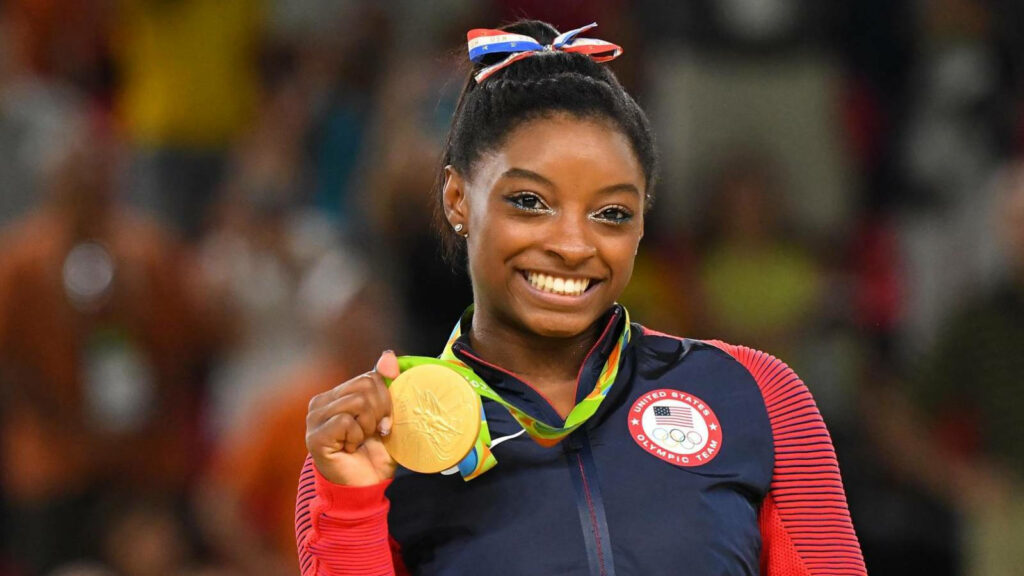 Simone Biles Gold Medal Celebration - Inspiring Wallpaper Background
