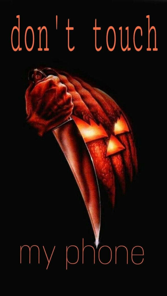 Halloween Horrors: Beware the Pumpkin's Wielded Warning on Screen Wallpaper
