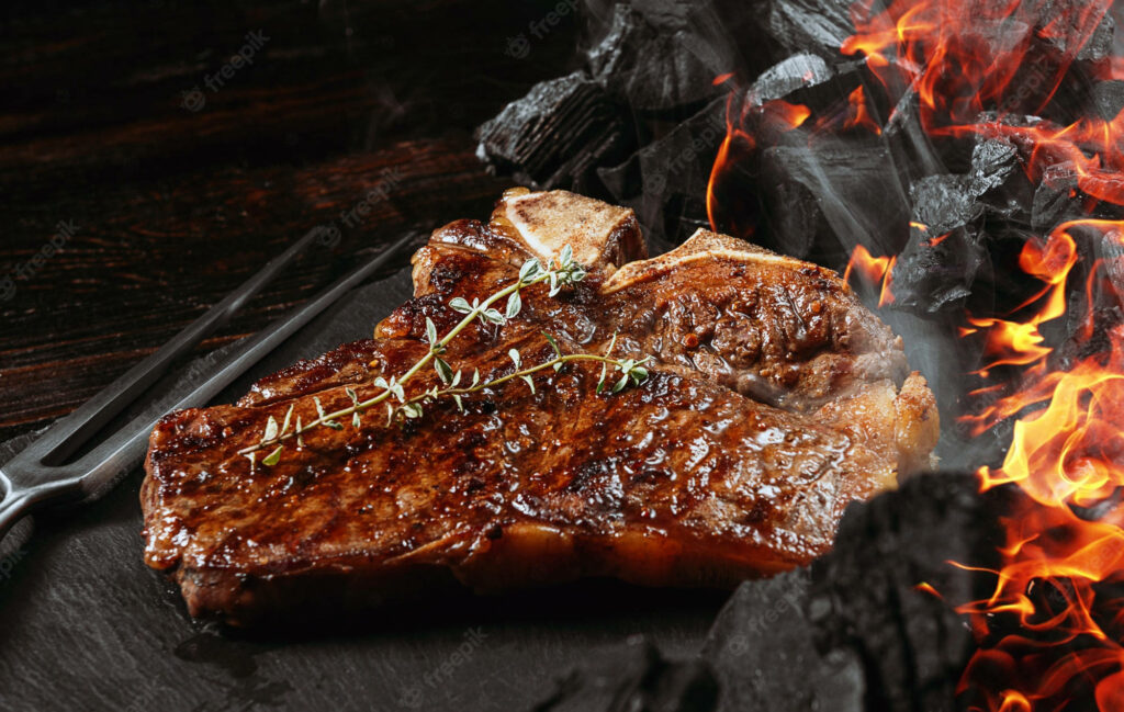 Sizzling Churrasco Steak with Basil & Flames - Rustic BBQ Wallpaper