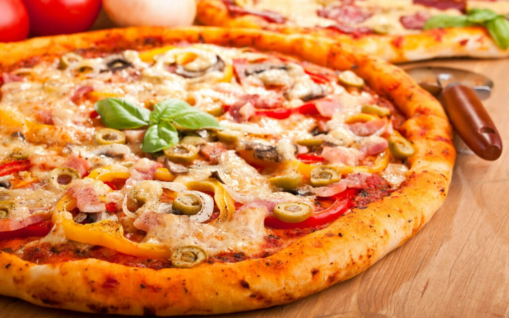 Savory Delights: Exploring Delectable Fast Food Pizza Varieties in HD Wallpaper
