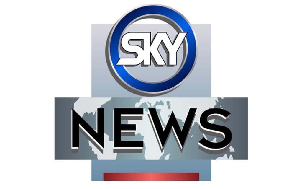 Sky News logo wallpaper with blue circular brand mark and bold dark news text on world map background