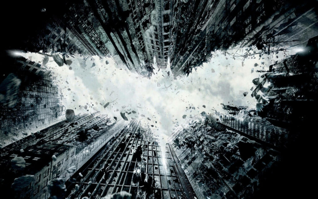 Gotham City skyline with crumbling skyscrapers forming Batman logo dark monochrome wallpaper