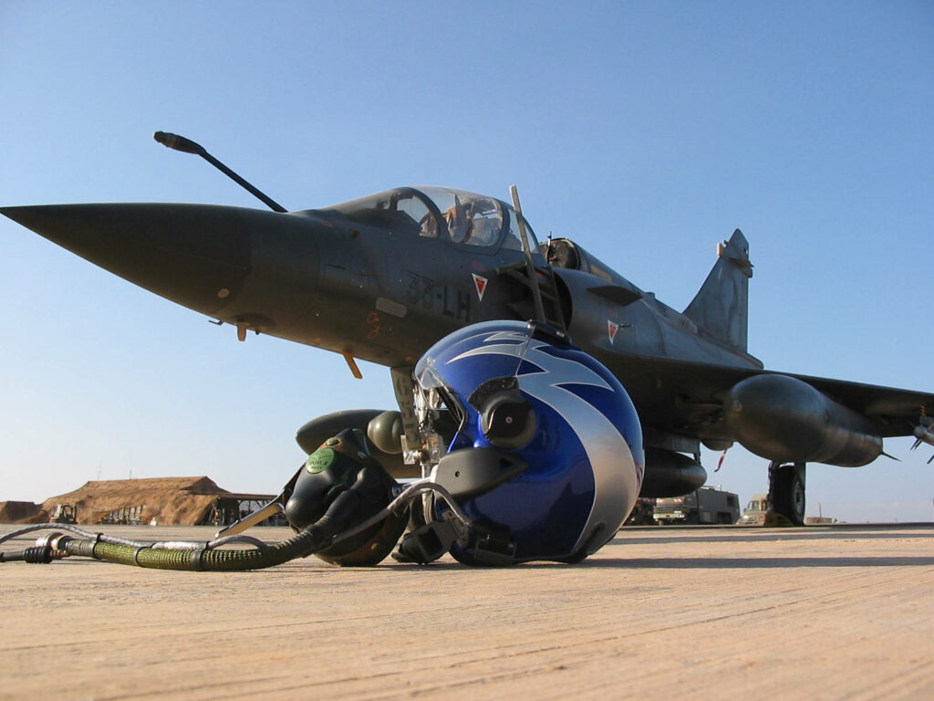 Exhilarating View: Capturing the Essence of a Dazzling Dassault Mirage 2000 Fighter Jet Against a Striking Fighter Jet Background Wallpaper