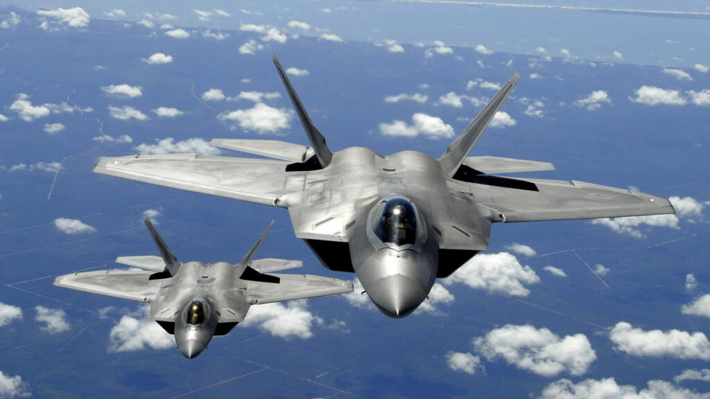 Skybound Spectacle: Majestic F-22 Raptor Jumbo Jets Soaring in Stunning 1080p Wallpaper