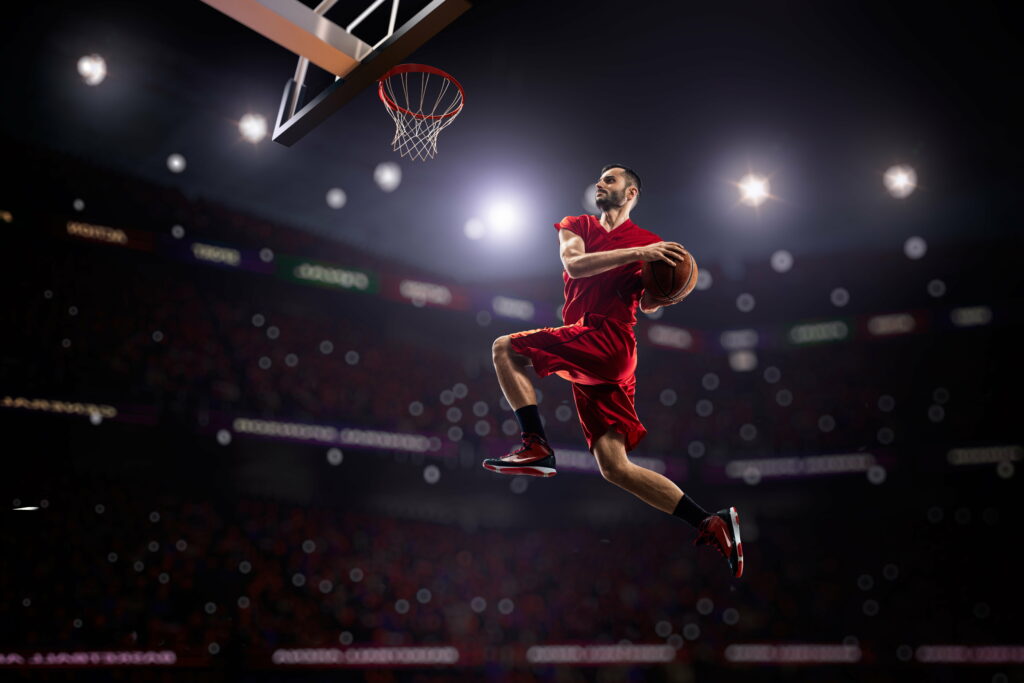Airborne Athlete: A Breathtaking Basketball Showdown in 8K Wallpaper