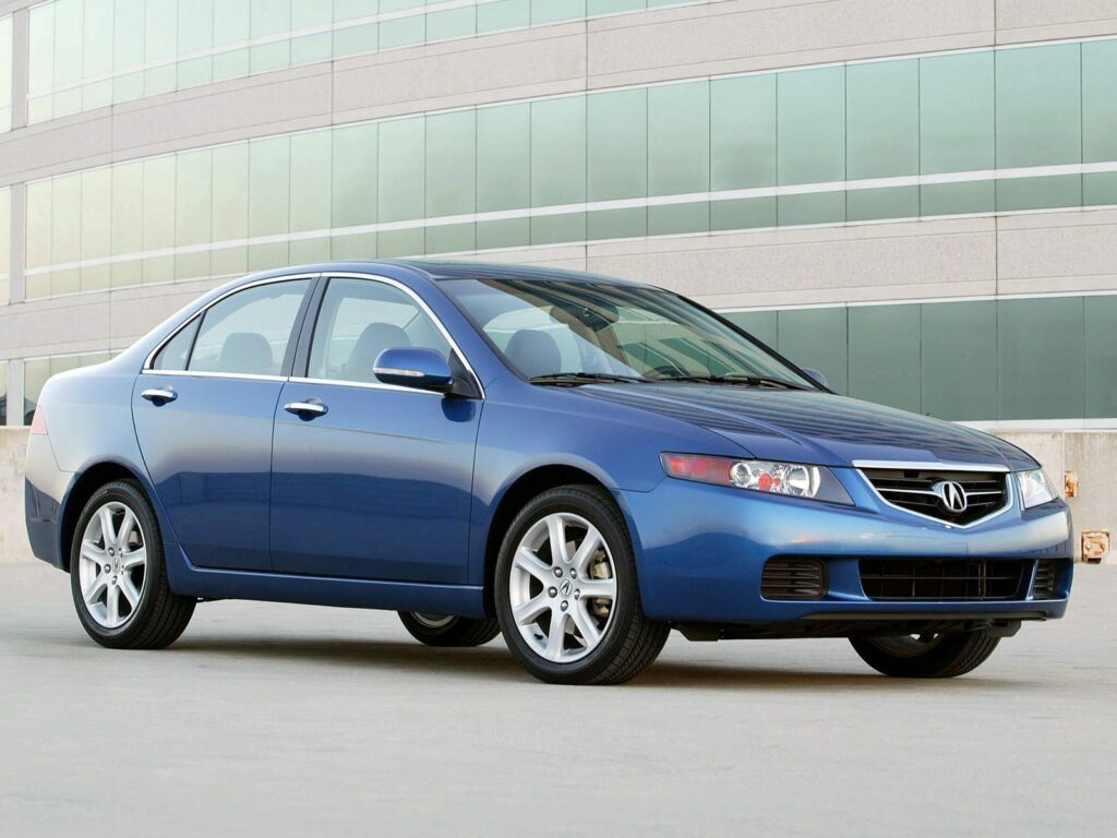 2003 Acura TSX Side View Wallpaper in Striking Blue with Urban Background