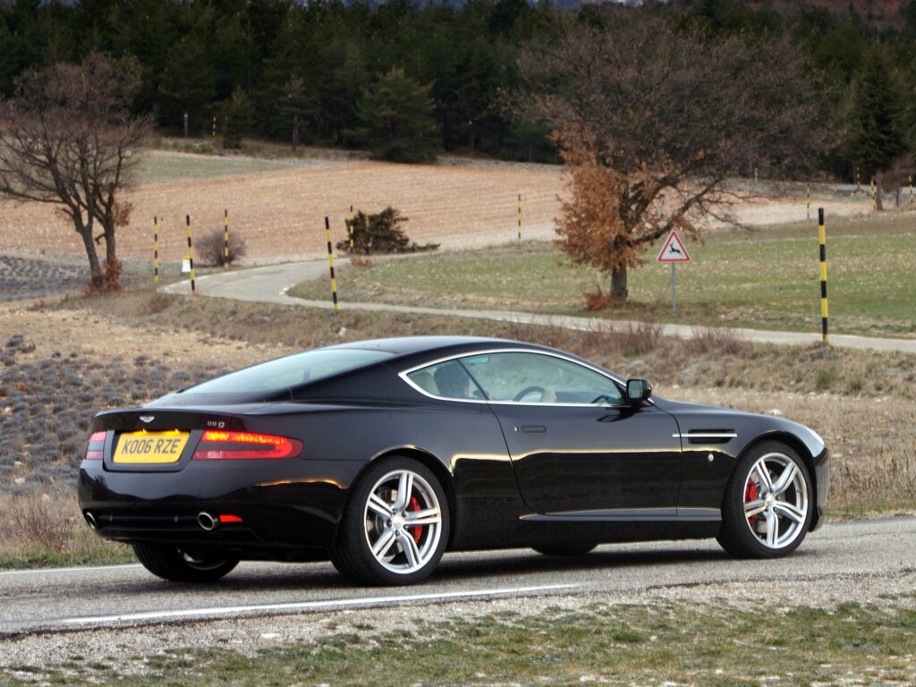 Sleek 2006 Aston Martin DB9 Wallpaper Against Scenic Nature