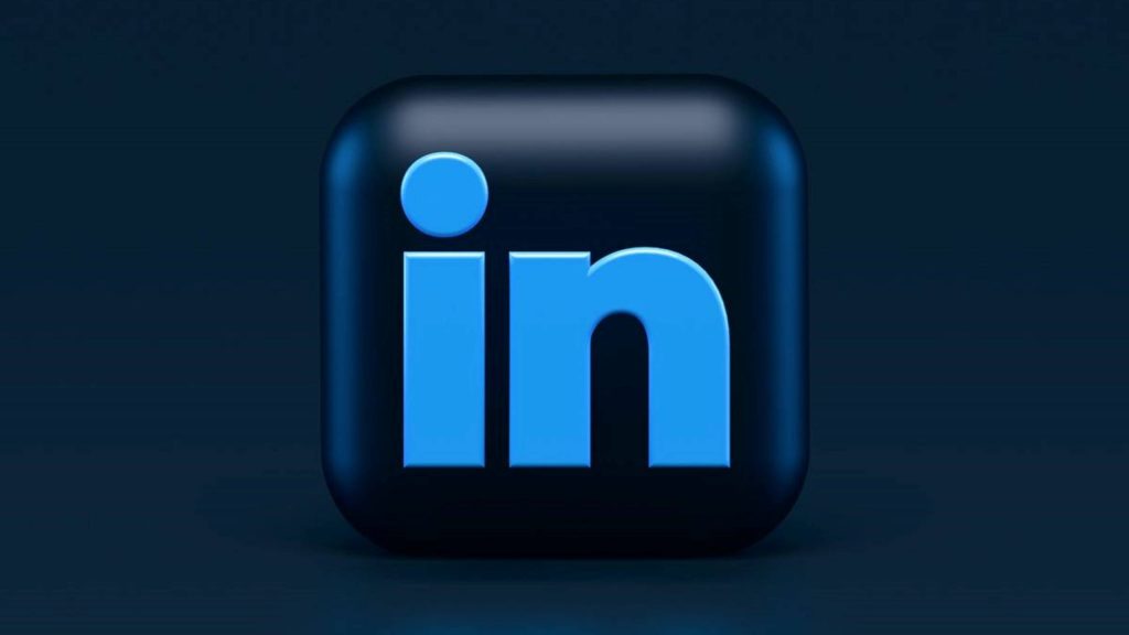 3D LinkedIn logo on dark navy cube minimalist wallpaper with soft lighting professional background