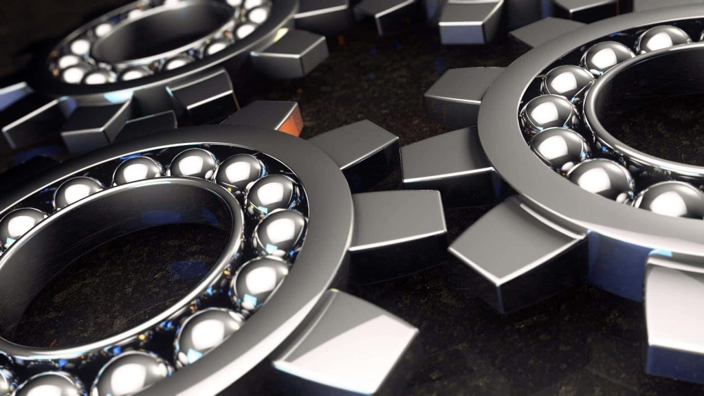 3D rendered polished metal ball-bearing gears interlocked on dark textured industrial background wallpaper