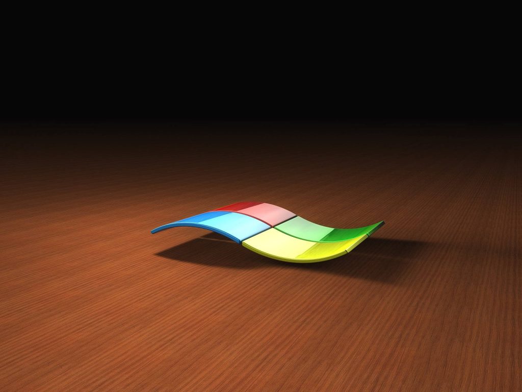 3D Windows logo on polished wood surface with spotlight and deep black minimalist background Wallpaper