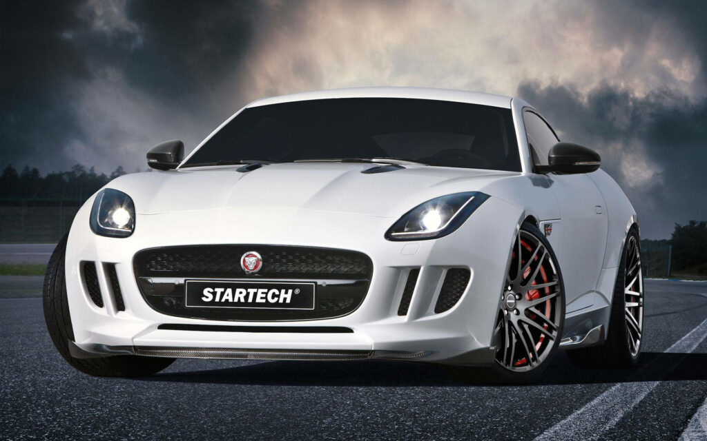 Sleek All-White Startech Jaguar F-Pace Wallpaper with Dramatic Sky