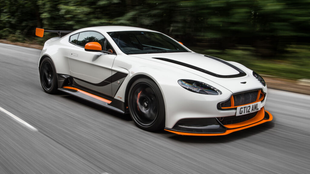 Sleek Aston Martin Vantage in Motion - Luxury Wallpaper Background