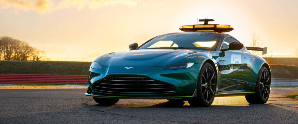 Sleek Aston Martin Vantage Police Vehicle Wallpaper at Sunset